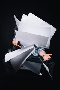 person throwing papers