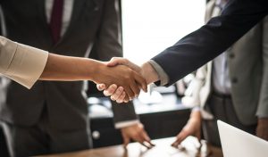 Business people shaking hands.