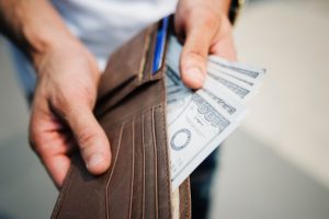Dollar bills in a wallet