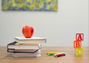 Textbooks on a desk in a classroom