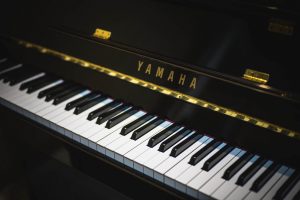 A black Yamaha piano to be relocated by piano movers NJ.