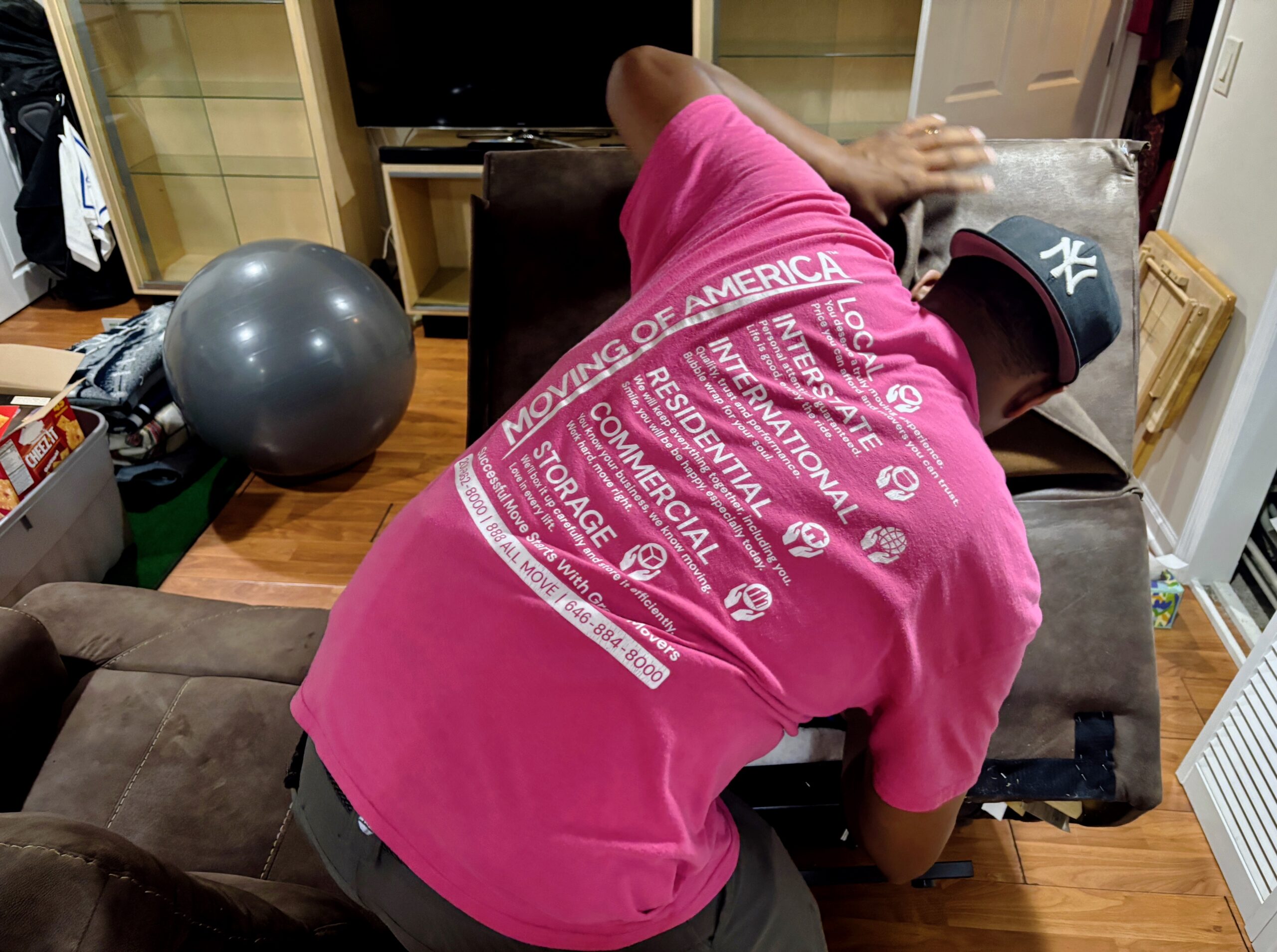 Estate movers in New Jersey carefully packing and handling household items during an estate transition.