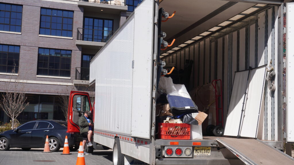 Moving of America team transporting medical equipment during a hospital relocation in New Jersey.