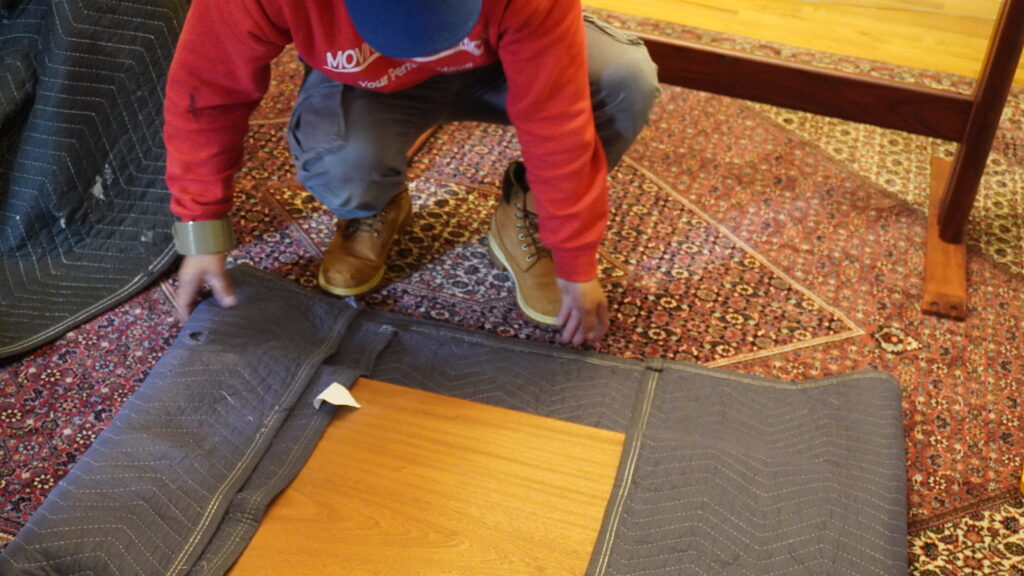 Moving of America team preparing household items for an interstate move.