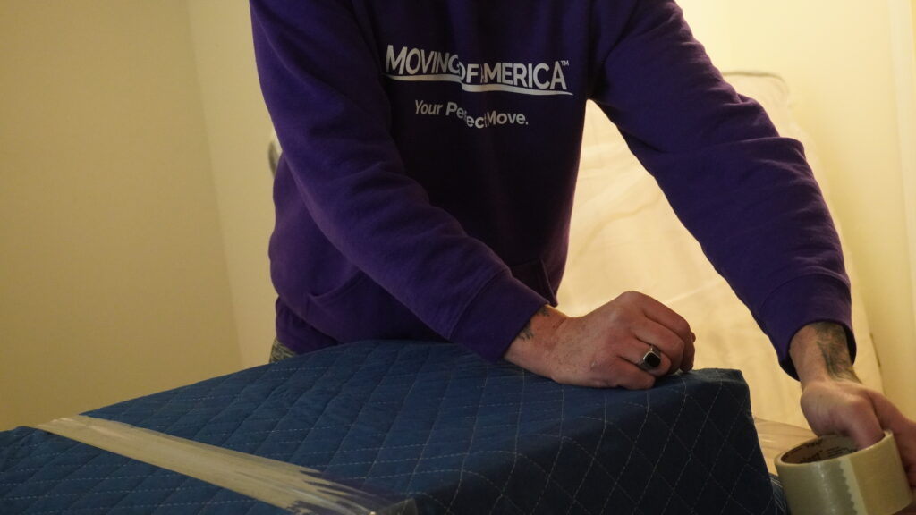 Specialty movers transporting fine art and luxury household pieces with custom padding.