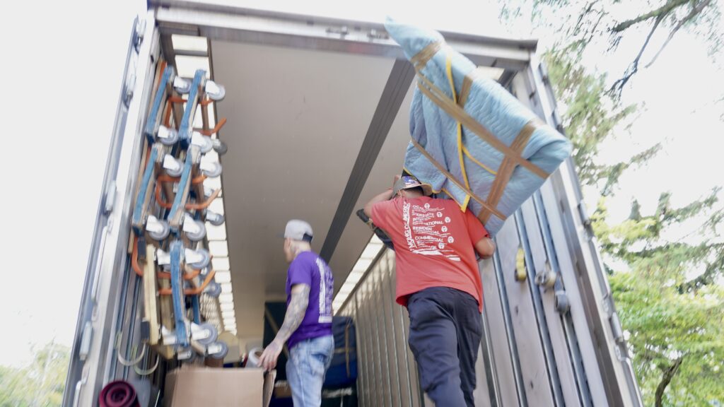 Crew performing safe and precise TV installation services in a New Jersey home.
