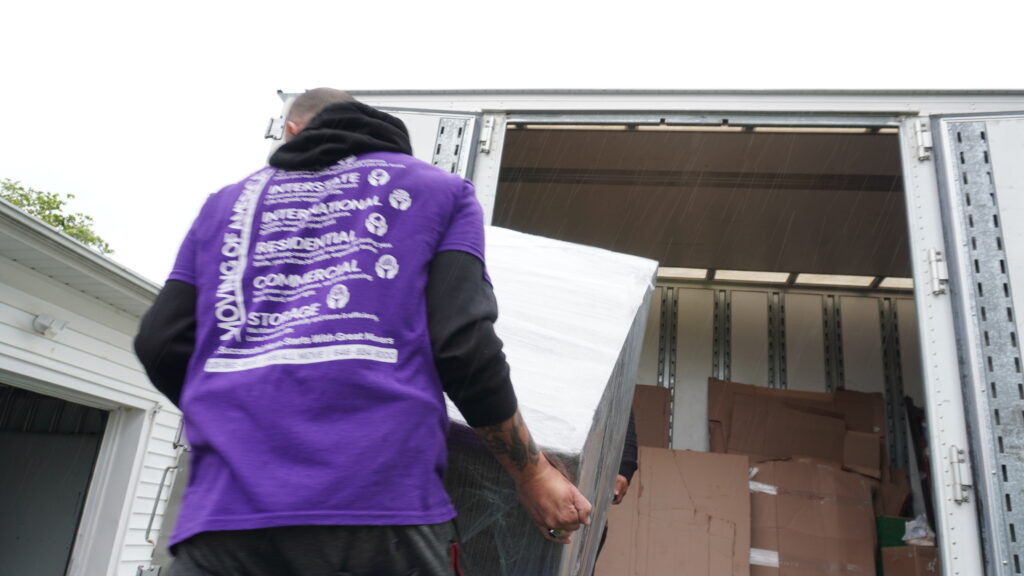 Safe moving experts preparing a high-weight safe for secure transport in New Jersey.